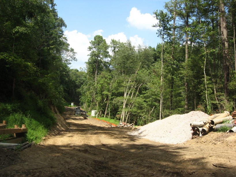 sewer runs under greenway at rocky overhang